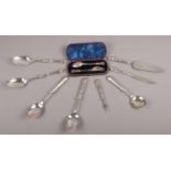A cased Victorian silver fork and spoon, along with a collection of silver handled cutlery.