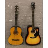 A Hokada Romanian acoustic guitar along with a StarSound acoustic guitar, both with carry cases.