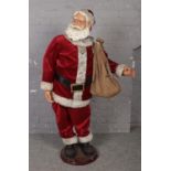 A large mechanical Father Christmas figure. (Height 147cm). No wires.