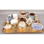 A tray of ceramics to include copper luster jugs, figures, oriental teapot etc.