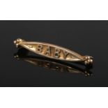 A 9ct gold "Baby" brooch. (0.84g).