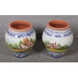 A pair of large painted terracotta vases. (Height 46cm).