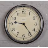 A Smiths bakelite wall clock. (18cm diameter).