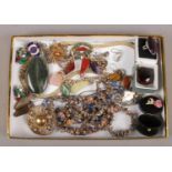 A tray of costume jewellery including dress rings, two marcasite necklets, pebble jewellery and