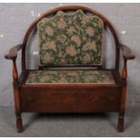 A carved oak upholstered bench with storage seat. (100cm x 100cm)