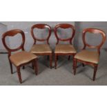 A set of 4 Victorian mahogany balloon back dining chairs.