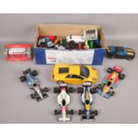 A box of diecast vehicles to include Bruago Formula 1 cars, large Maisto Lamborghini etc.