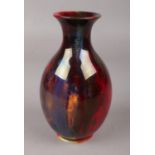 A Royal Doulton Flambe baluster shaped vase. (Height 16.5cm).