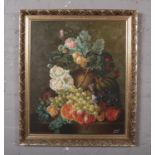 A gilt frame oil on canvas, still life with fruit and flowers, signed indistinct. (60cm x 50cm).