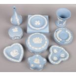 A small collection of blue Wedgwood jasperware to include vases, trinket dishes etc.