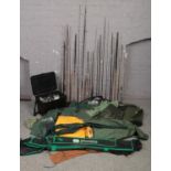 A large quantity of fish equipment to include fishing box, reels, rods, clothing, keep net etc.