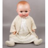 An Armand Marseille composite Baby doll, 63cm height