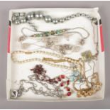 A tray of costume jewellery, to include pendants on chains, necklaces etc.