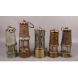 Five vintage miners lamps, to include JS&S The Governor Lamp example.