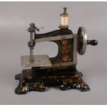 A Victorian tinplate child's sewing machine, made in Germany No 259866