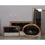 Four gilt frame bevel edge wall mirrors.