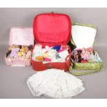 A collection of dolls and doll accessories to include clothing, etc.