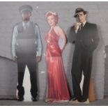 Three full size cardboard cut outs, Marilyn Monroe, Humphrey Bogart & Police officer. (183 cm height