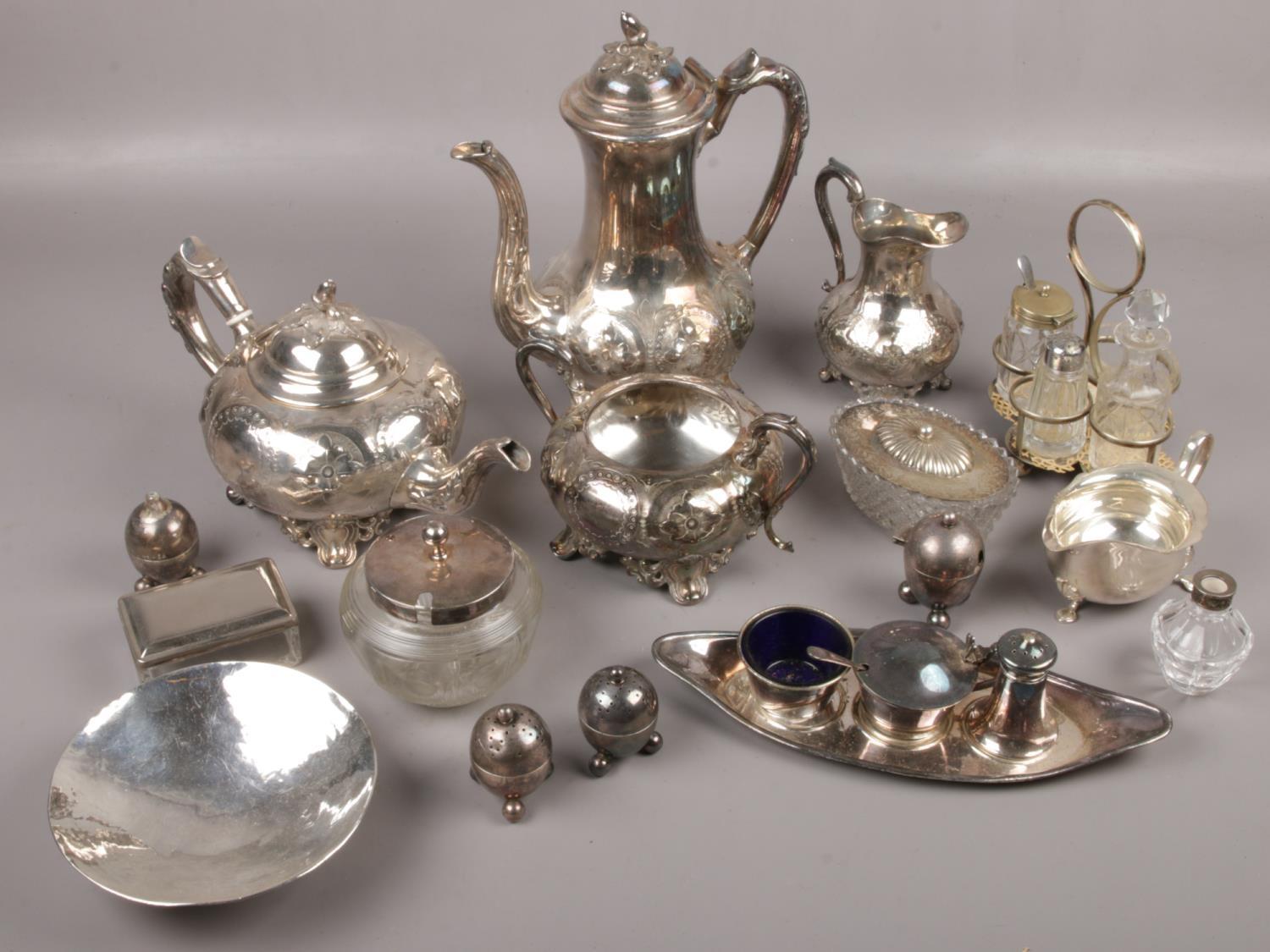 A box of silver plate to include coffee pot, teapot, cream jug, cruet sets etc.