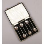 A cased set of silver demitasse spoons, with coffee bean terminals, assayed Birmingham 1938 by