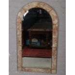 A large dome top bevel edge wall mirror with tile and gilt metal boarder. (115cm x 65cm)
