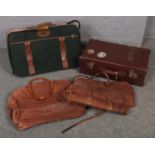 A vintage leather suitcase with leather mounts, stencilled R.E.S along with a quantity of holdall
