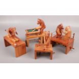 Four mechanical wood carvings; skiing bear, snooker playing bear, golfer and boxing bears