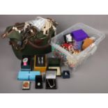 A handbag and a box of costume jewellery to include designer, watches, beads, bangles etc.