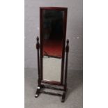 A mahogany bevel edge cheval mirror.