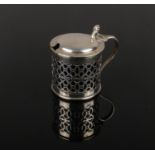 A Victorian pierced silver mustard pot with Bristol blue glass liner. Assayed London 1896. Silver 49