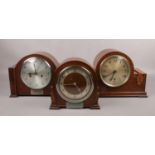 Three carved oak mantel clocks, to include two presentation examples.