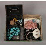 A tray of costume jewellery, to include tin money box, French jet, beads etc.