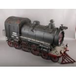 A large metal scratch build model steam locomotive, incorporating quartz clock to the front and