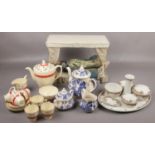 A box of miscellaneous to include doll with doll's bed, Newhall tea service, old willow ceramics