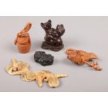 A box of oriental collectables including carved netsuke.