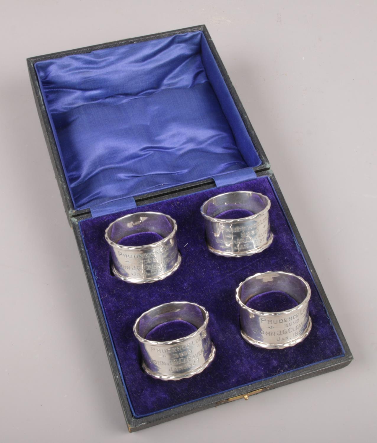 A cased set of four George V masonic silver serviette rings, Prudence Lodge 3559, assayed Birmingham