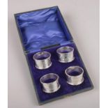 A cased set of four George V masonic silver serviette rings, Prudence Lodge 3559, assayed Birmingham