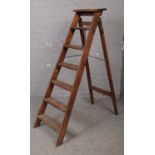 A wooden vintage step ladder.
