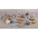 A collection of paperweights, various sizes and colours