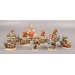 A collection of nine Goebel Hummel figures.