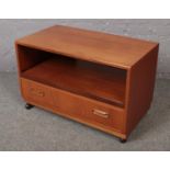 A teak tv cabinet with drawer base. (83cm x 43cm)