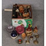 A box of miscellaneous to include Wade whiskey decanters, brass candlesticks, coffee grinder, etc.
