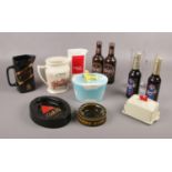 A collection of advertising ceramics, to include Johnnie Walker Black Label, Bass Cask Ale ash tray,