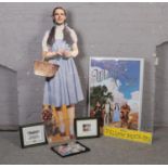 A collection of Wizard of Oz film memorabilia to include Dorothy' cardboard cut out, Follow the