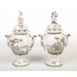 A pair of 19th century French faience rose jars. Each of baluster form and with domed covers