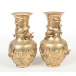 A pair of early 20th century Chinese polished bronze vases decorated with coiled dragons. Seal