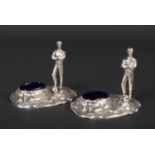A pair of George V silver plated novelty salt sellers with Bristol blue glass liners. Each