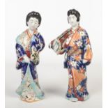 Two Japanese Meiji period Kutani figures. Each formed as a Bijin dressed in a flowing robe and