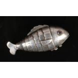 A 19th century silver spice box on the form of a reticulated fish. With engraved detail and cabochon
