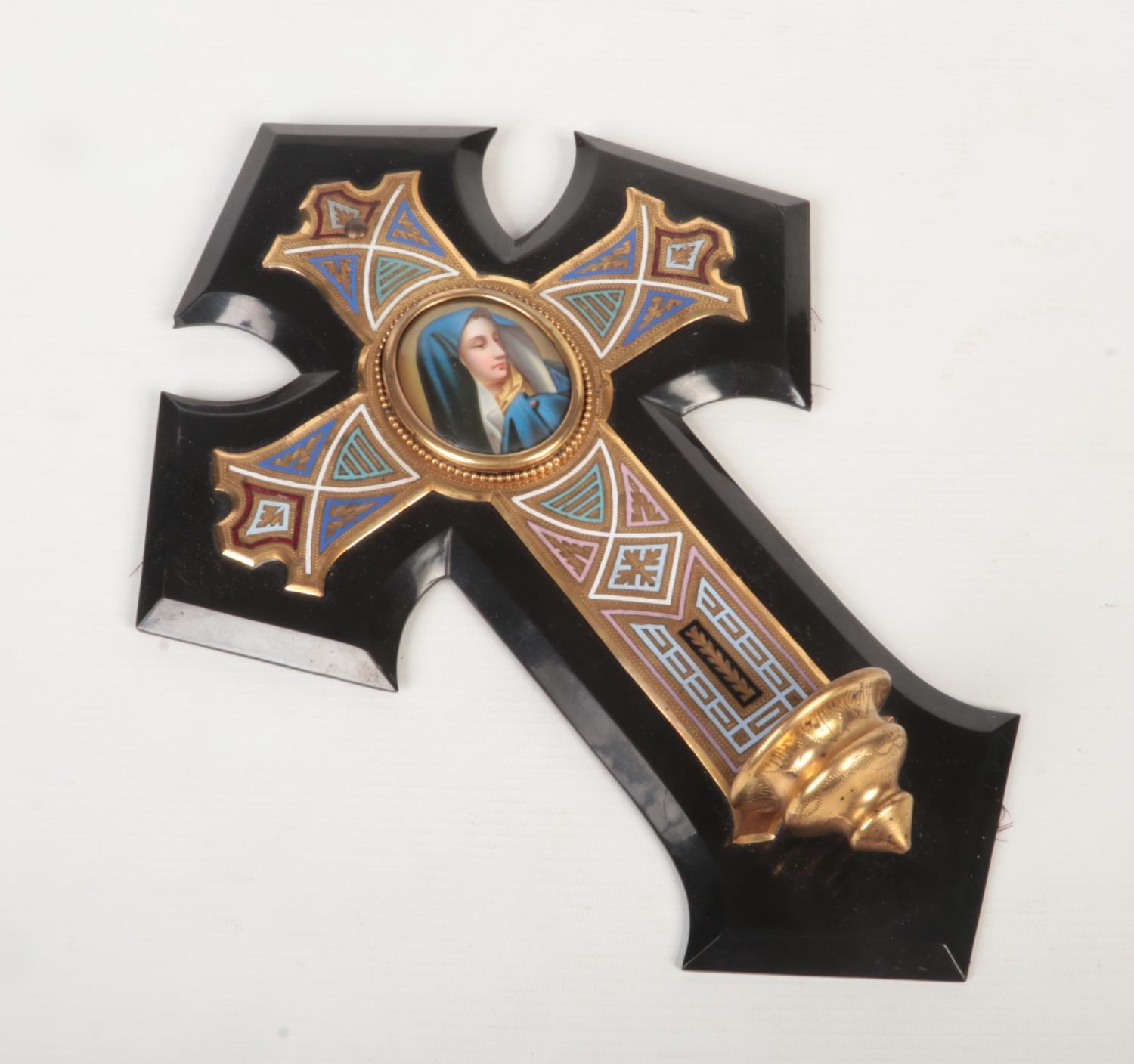 An early 20th century champlevé enamelled brass crucifix / holy water stoop mounted on slate. Set to